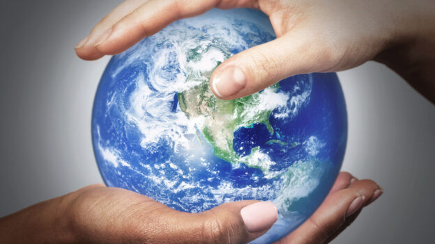 African and Caucasian female hands holding earth globe. Different concept such as ecology, international friendship and equality. Elements of this image furnished by NASA.