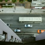 several vehicle on road between concrete structures